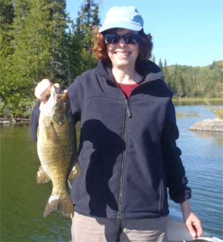 Woman Trophy Fishing Smallmouth Bass in Canada